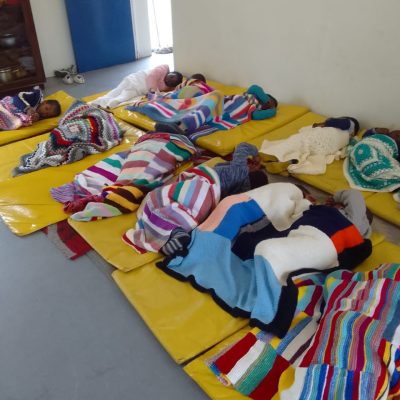 Kids at Sam's Crèche with their new woollen blankets_May2022